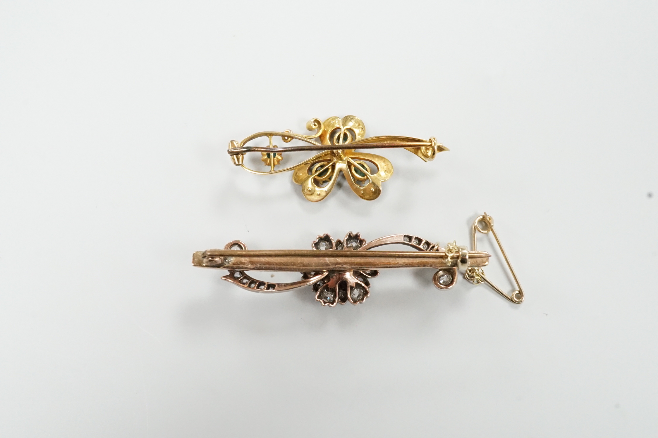 Two late Victorian yellow metal and gem set bar brooches, including sapphire and diamond, 46mm and turquoise and seed pearl, gross weight 9 grams.